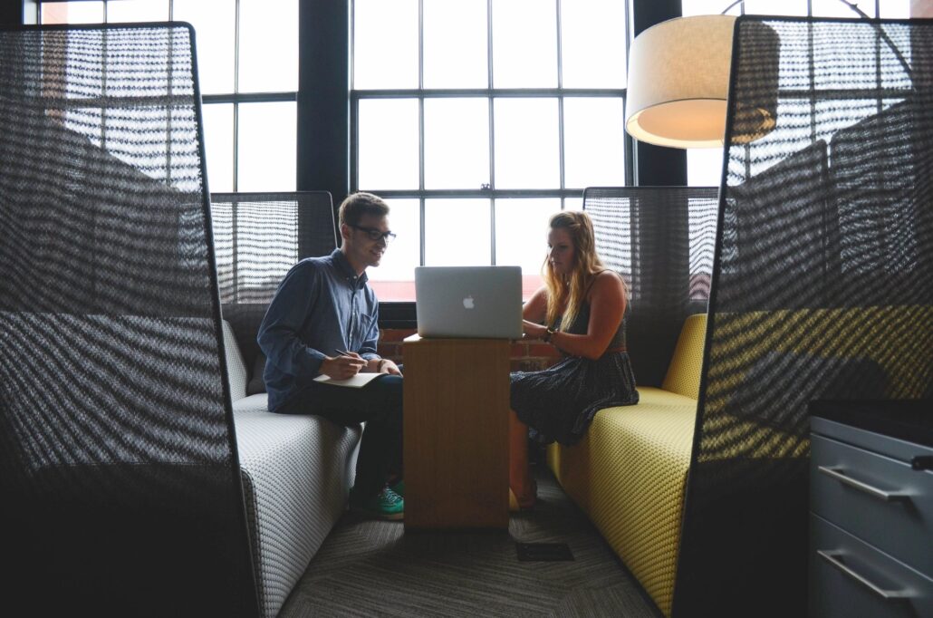 Agent and customer on a computer.